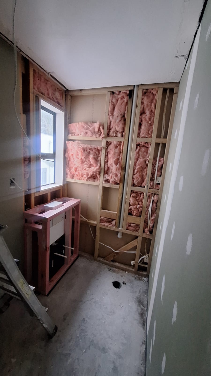 Bathroom stripped back to timber framing with insulation, new pipework and shower waste roughed in
